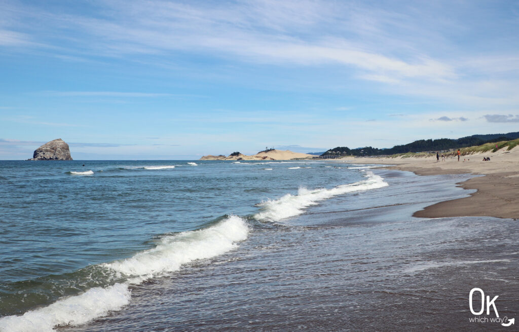 Looking north towards Chief Kiwanda Rock, also known as Haystack Rock, and Cape Kiwanda in Pacific City, Oregon | OK Which Way